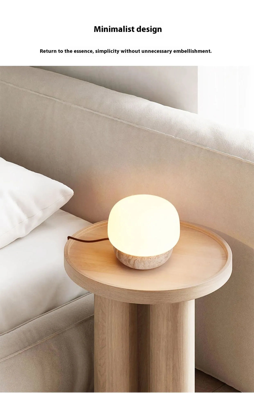 Cream-coloured retro style bedside lamp on a table.