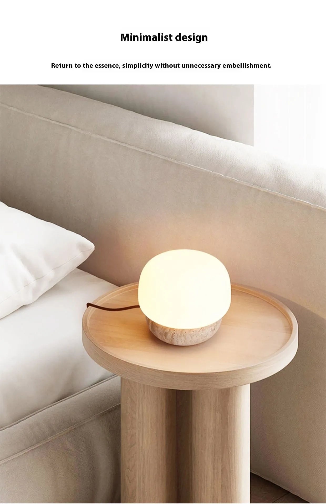 Cream-coloured retro style bedside lamp on a table.