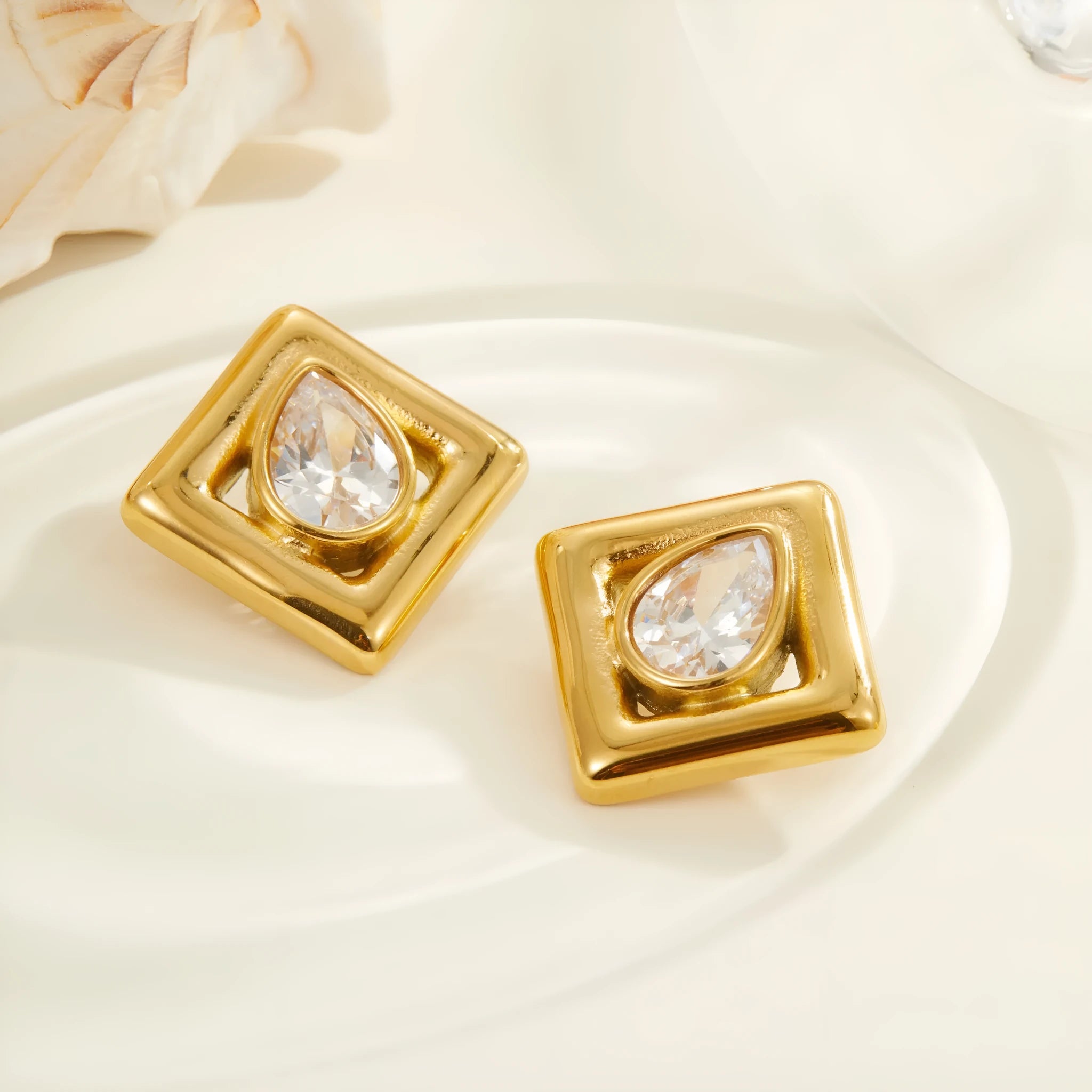 Gold electroplated stainless steel stud earrings with water drop zircon design