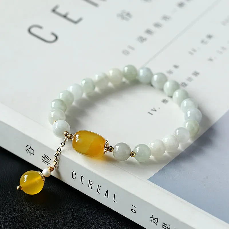 Women's bracelet with 7.5mm round agate beads and hanging tassel in 14K gilded finish