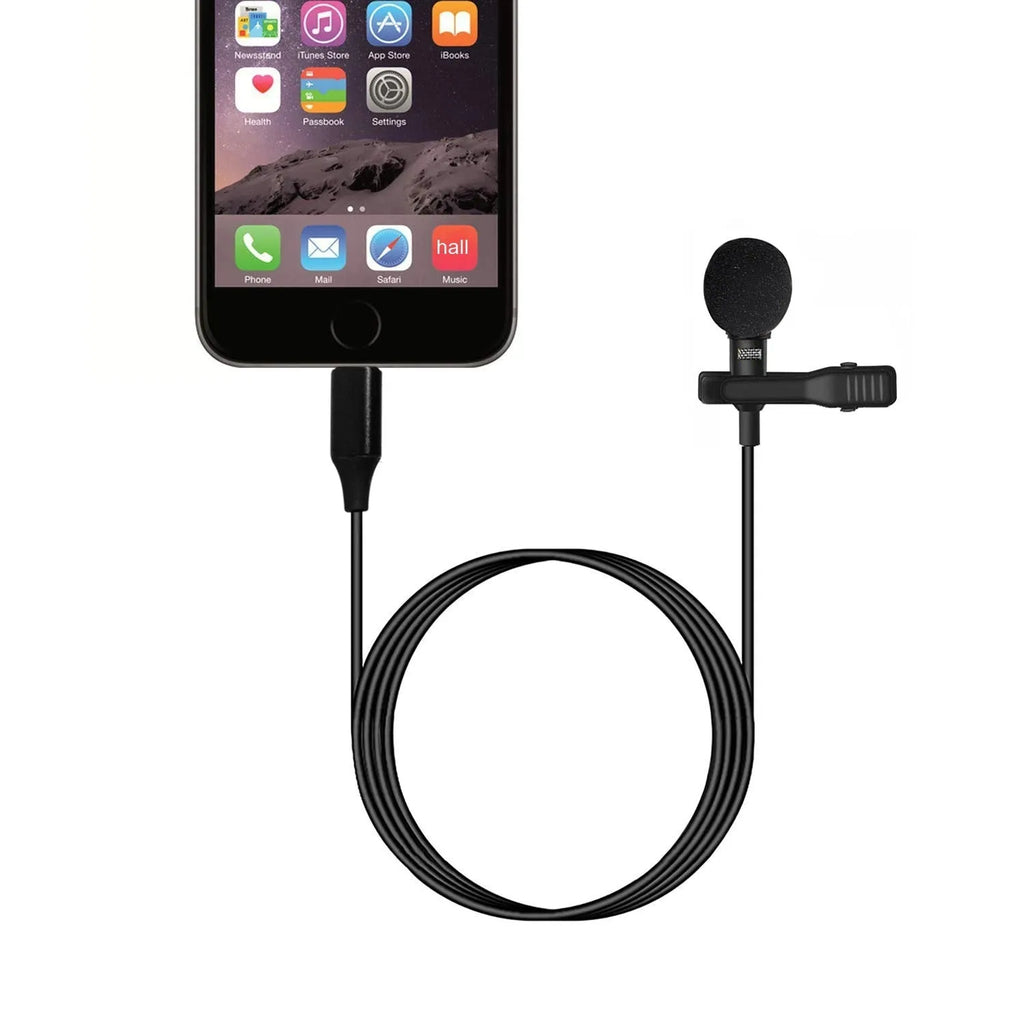 Black USB-C lavalier microphone with metal clip and sponge cover on a table