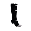 Women's grey knee-high boots with stiletto heels showing shaft height and PU leather texture