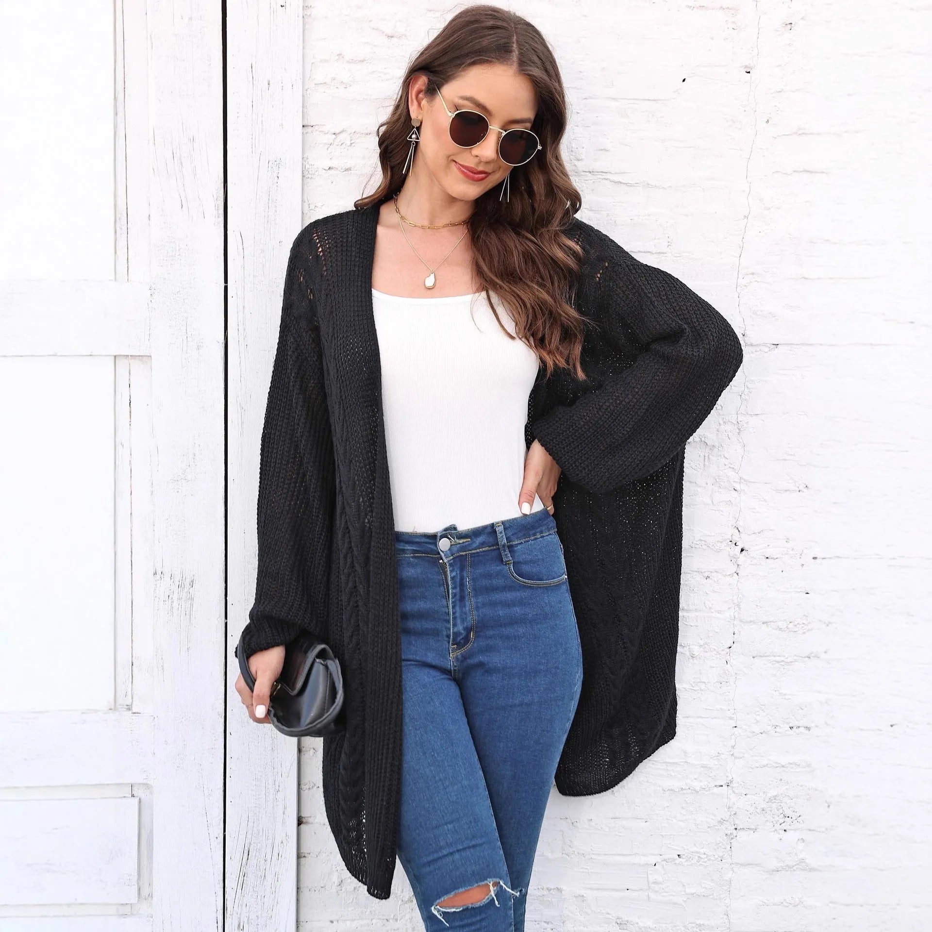 Women's loose fit brown acrylic sweater coat, open front cardigan style on hanger