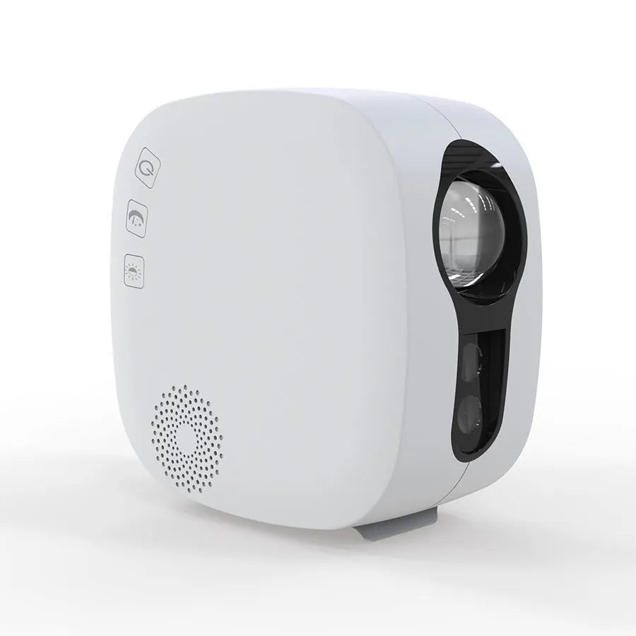 Laser starry sky projection lamp with colourful nebula moon effect and Bluetooth music playing, black unit on a desk