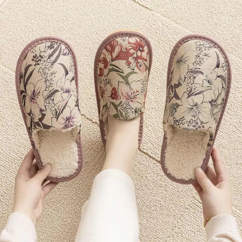 Warm winter linen surface household cotton slippers with PVC sole in gold coffee/cotton colour on a wooden floor