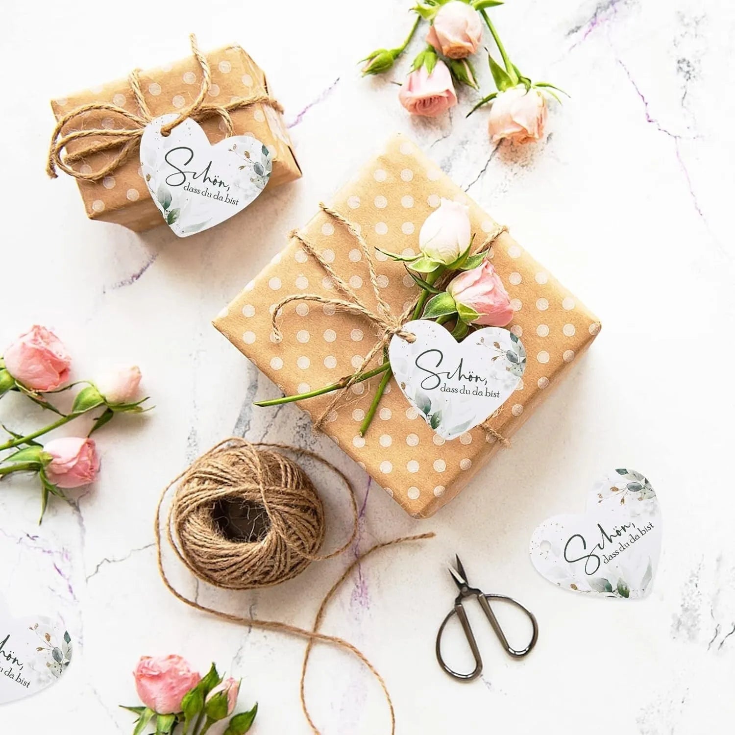 50-piece heart-shaped gift tag set with floral design in two style options