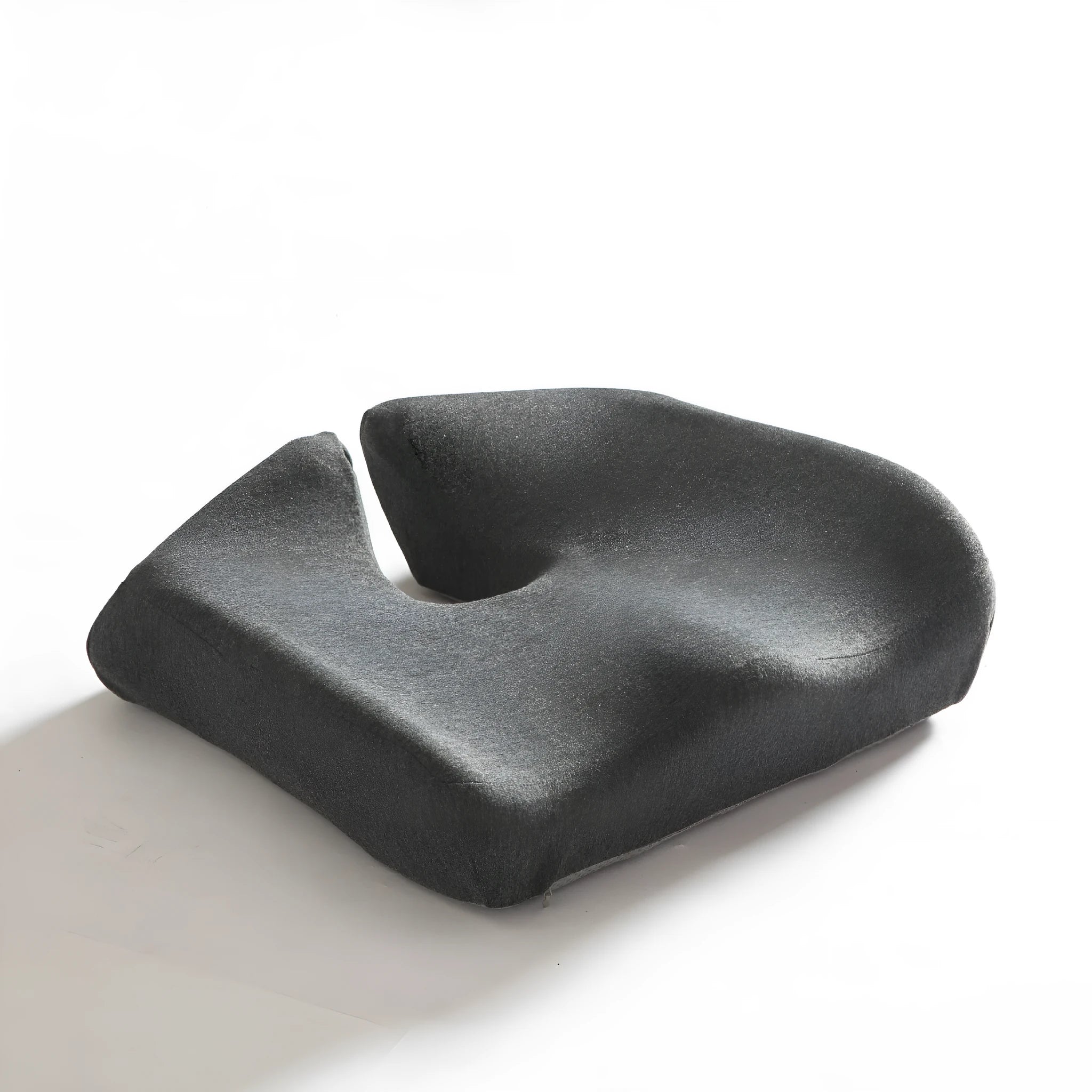 Memory foam office chair cushion in a solid colour, shown on a desk chair for scale.