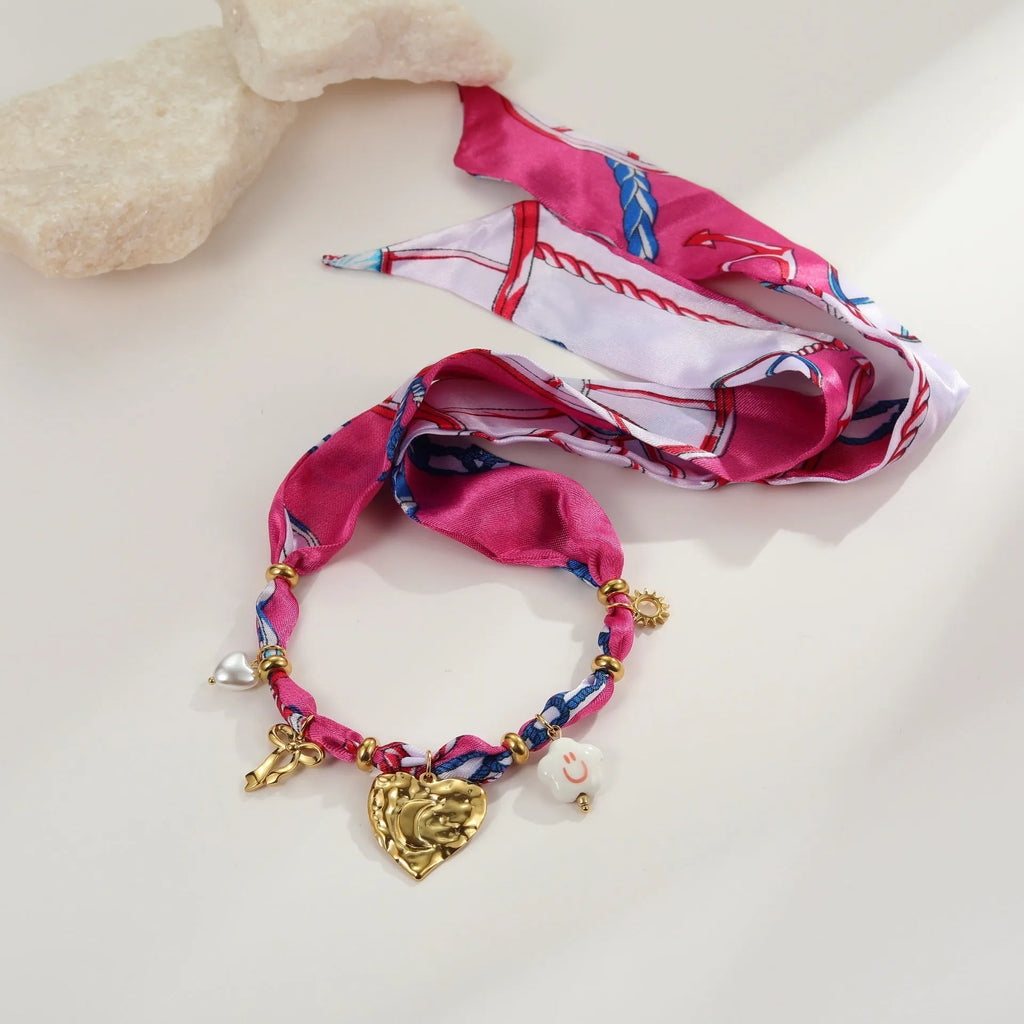 Love pendant necklace and bracelet set with geometric design in 18K electroplated stainless steel