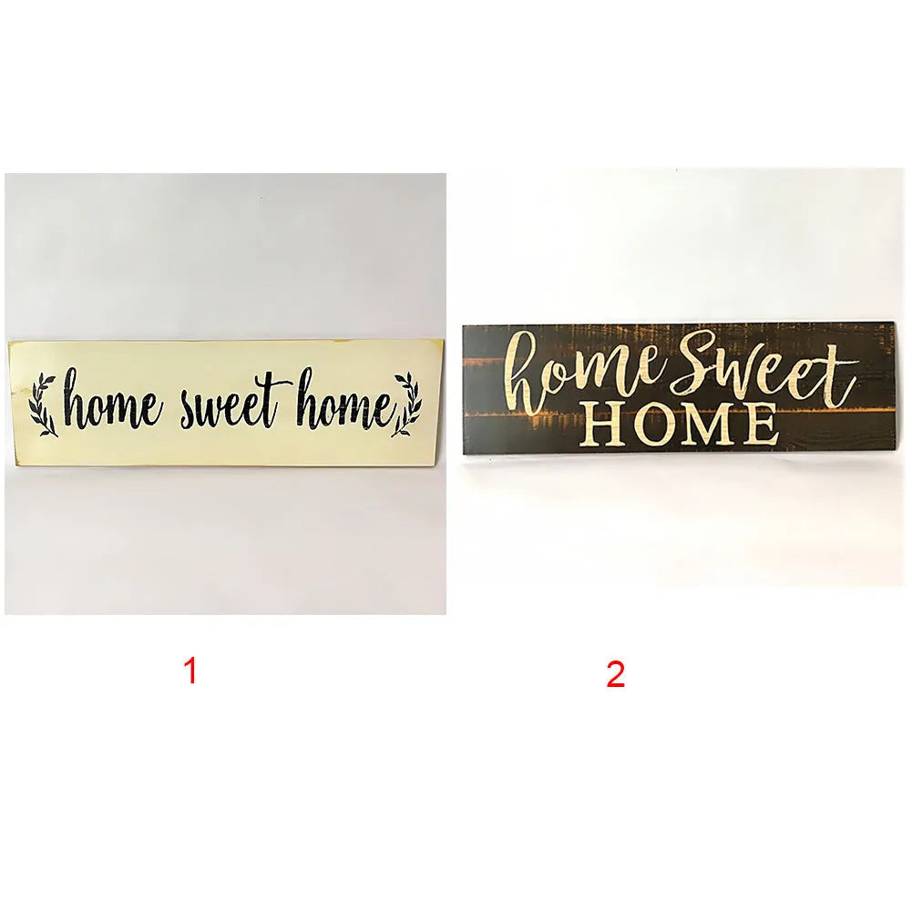 Home Sweet Home wooden carved pendant in black, 40cm x 12cm, hanging on a light wall
