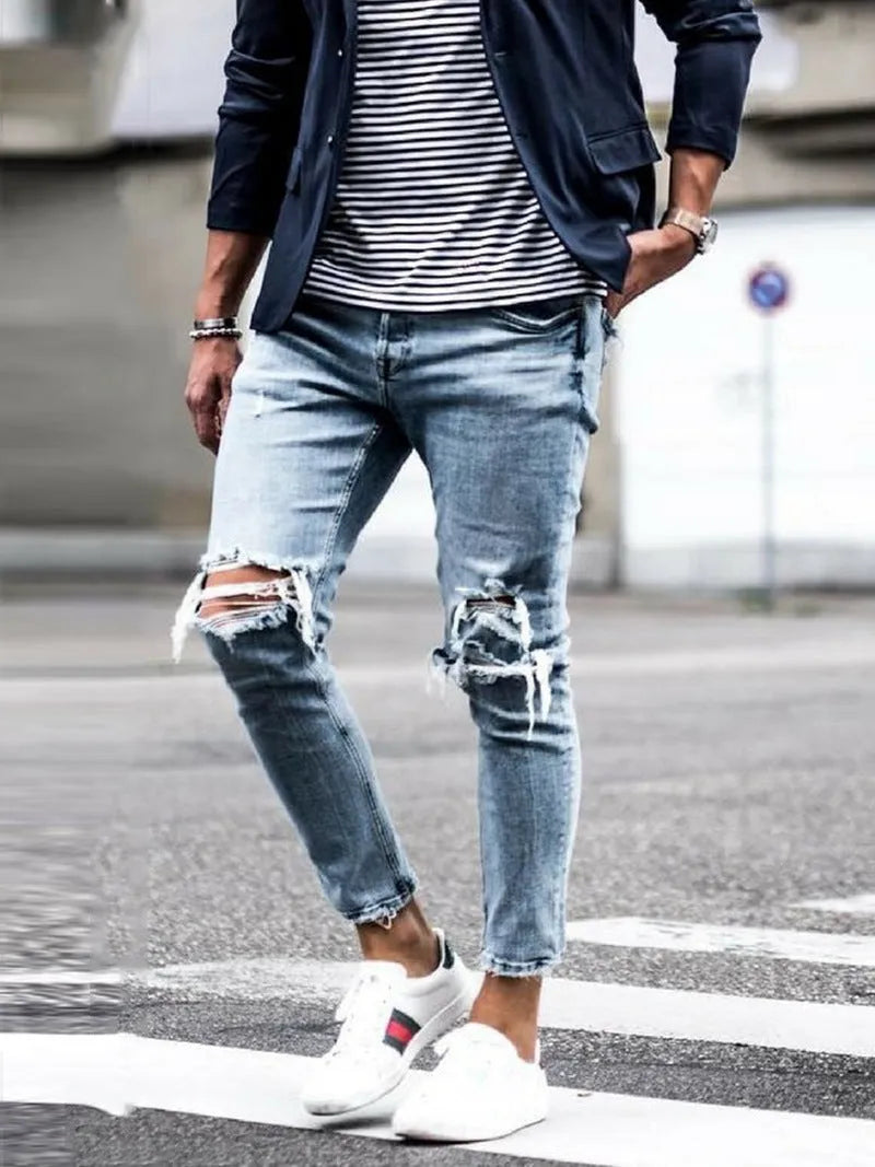 Men's light blue straight fit jeans with worn and embroidered detailing, five-point length, mid-rise waist