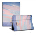 Silicone book-style iPad cover with dreamy painting style sailing design, fits multiple iPad sizes