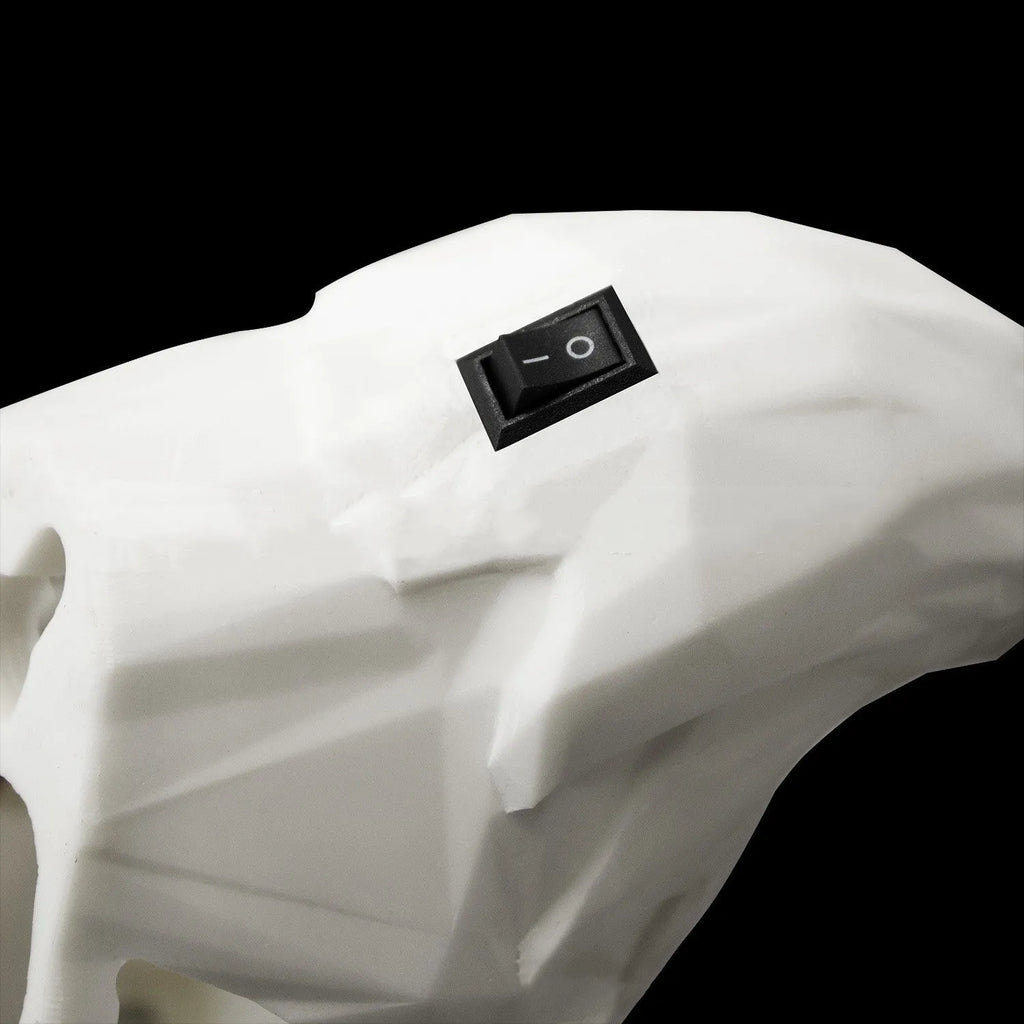 Eagle-shaped resin wall lamp with 3D print body projecting light and shadow on a wall