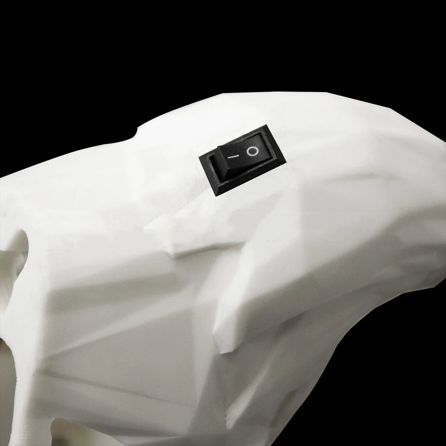 Eagle-shaped resin wall lamp with 3D print body projecting light and shadow on a wall