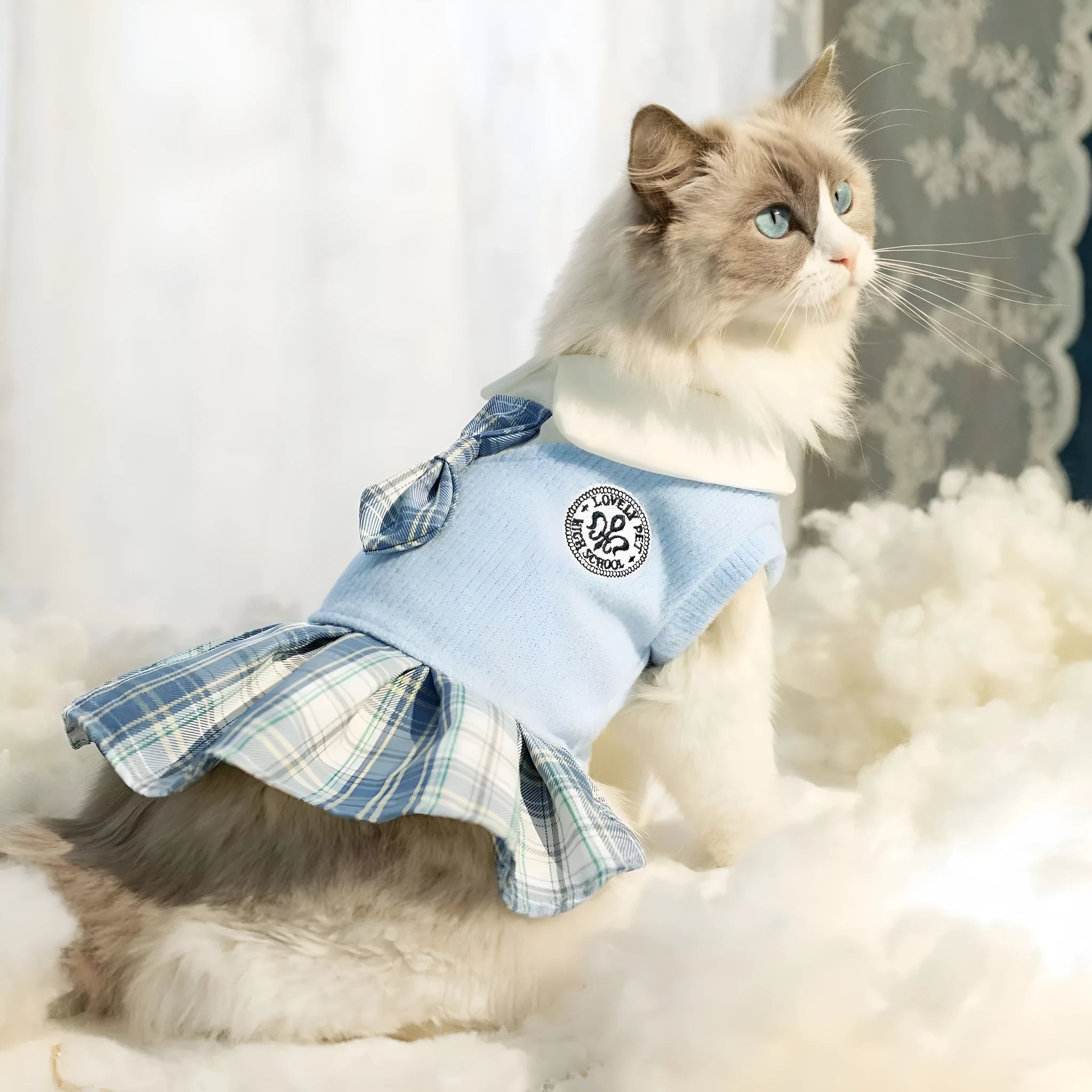 A pink tartan skirt with princess styling for a small dog mannequin.