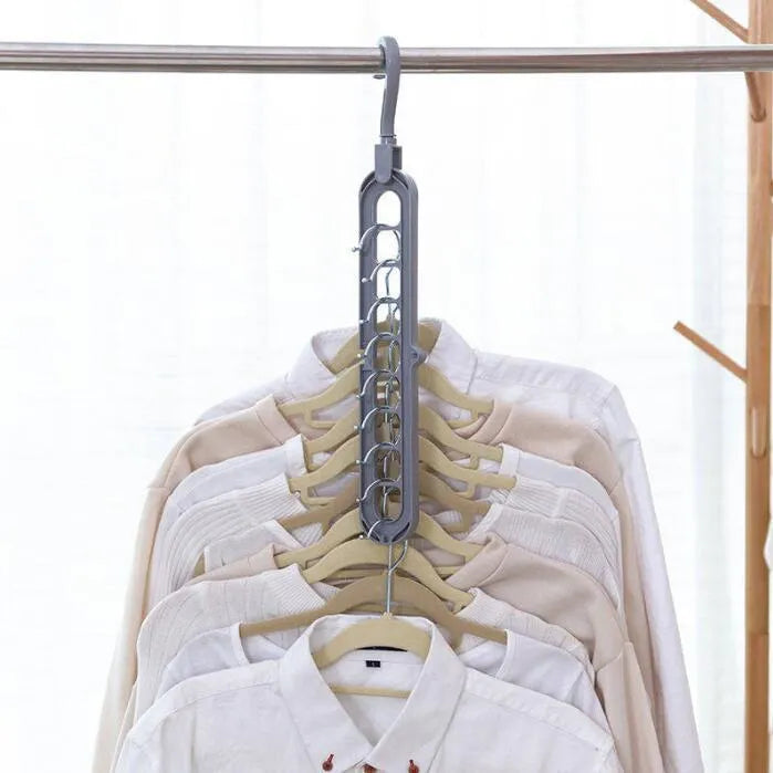 Plastic clothes hanger with 360° rotating hook, 33 cm long, in green colour on white background