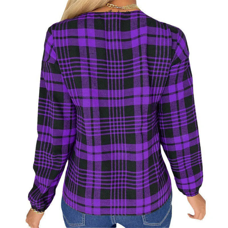 Women's loose-fit purple plaid casual shirt with long sleeves on a hanger.