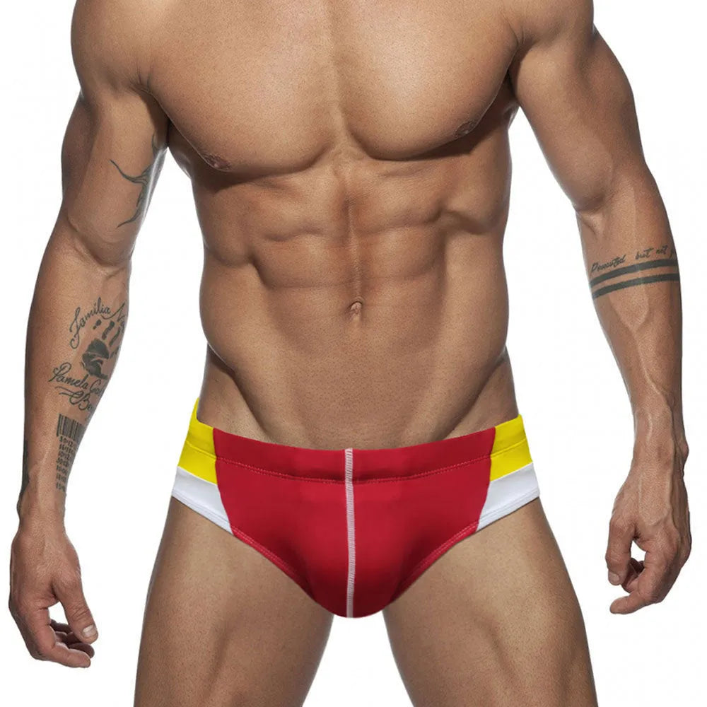 Men's nylon swim briefs with bright line colour matching and hip drainage line, available in red and dark blue