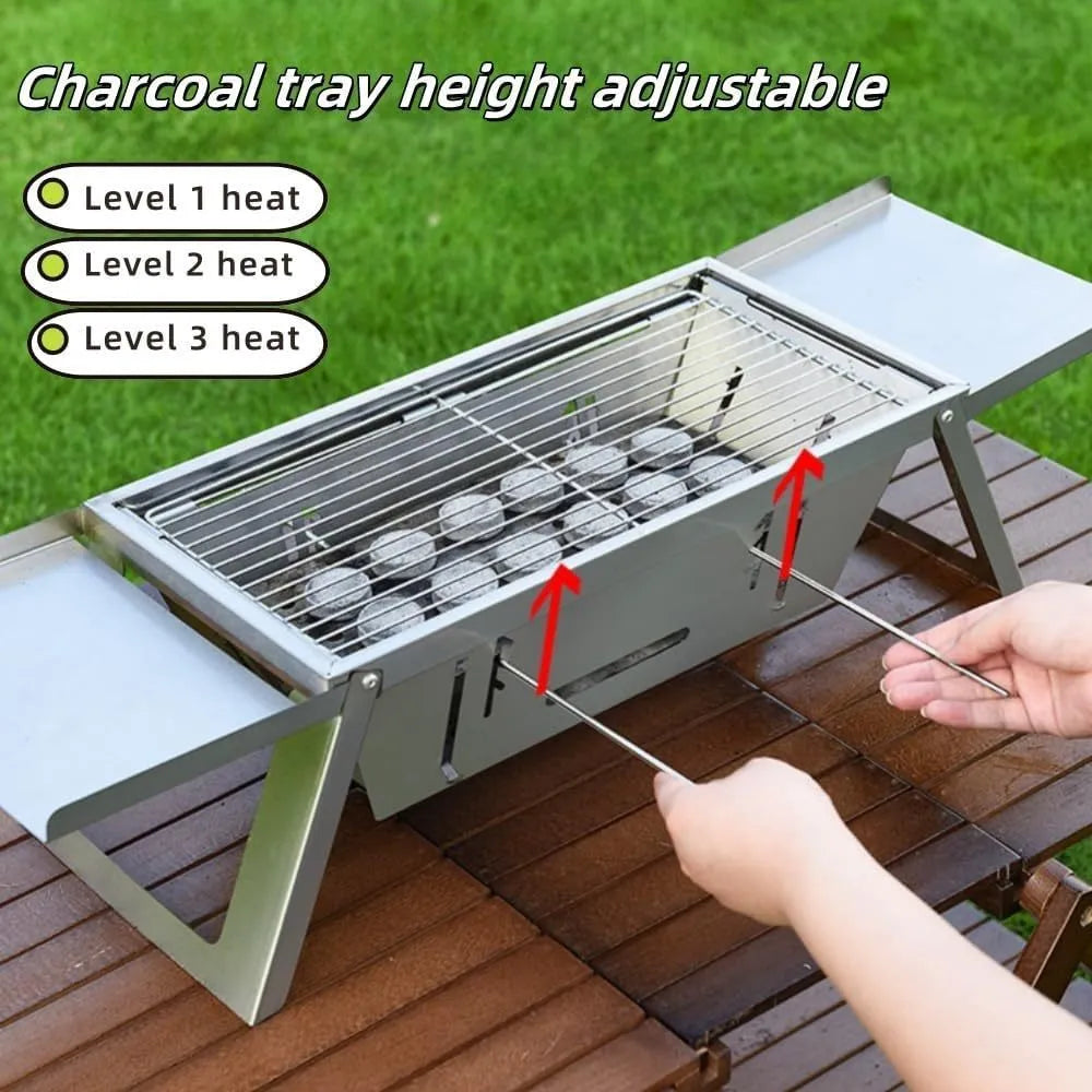 Small portable charcoal grill with folding metal frame for outdoor cooking