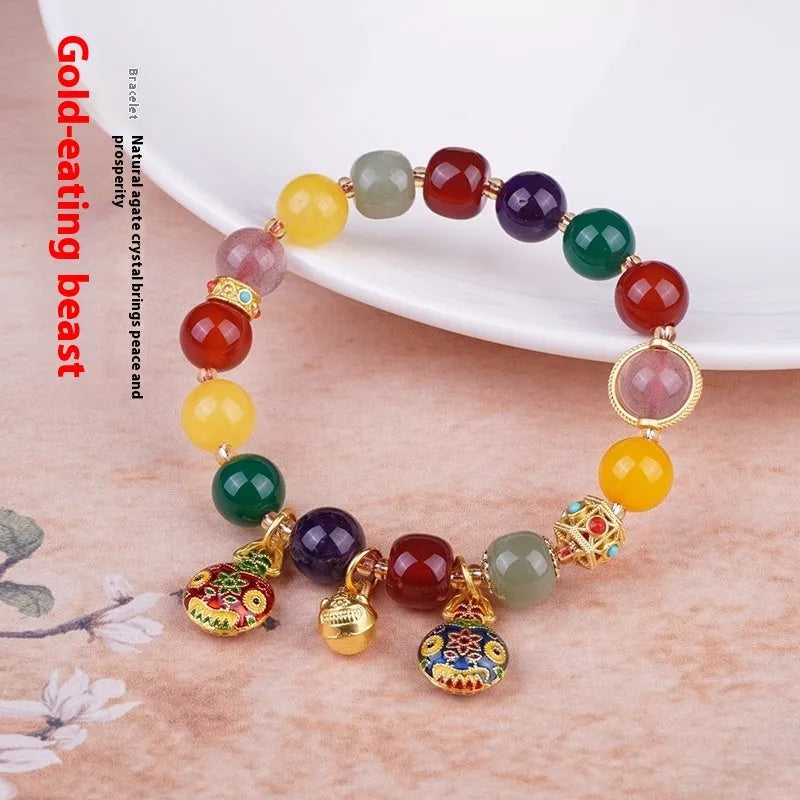 Swallowing Gold Beast agate crystal bracelet with 10mm beads, hand-woven, animal zodiac style on neutral background