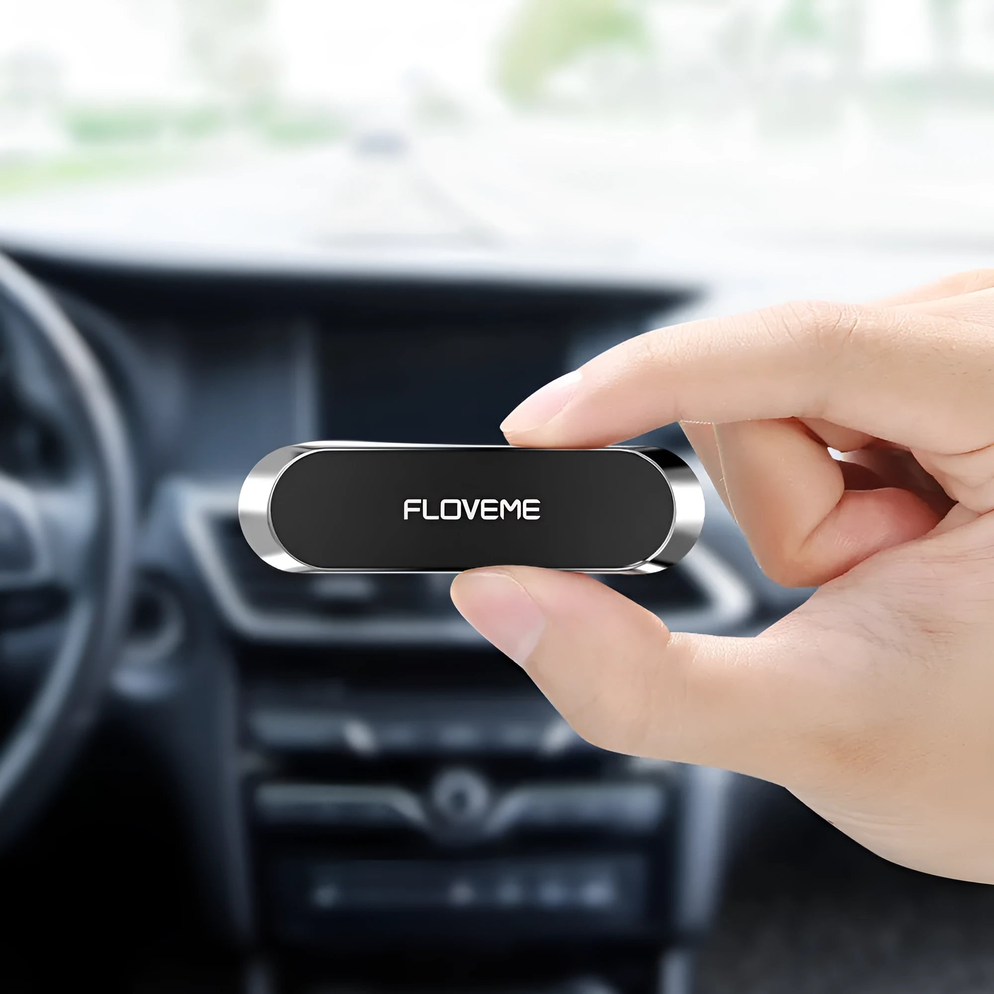Black magnetic car and home mobile phone holder with silver iron sheet and white foam glue.