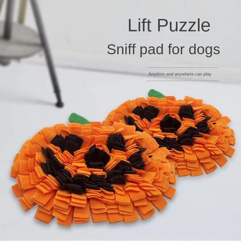 Orange pumpkin-shaped pet sniffing mat with soft fur fabric, 30cm diameter, on a wooden floor