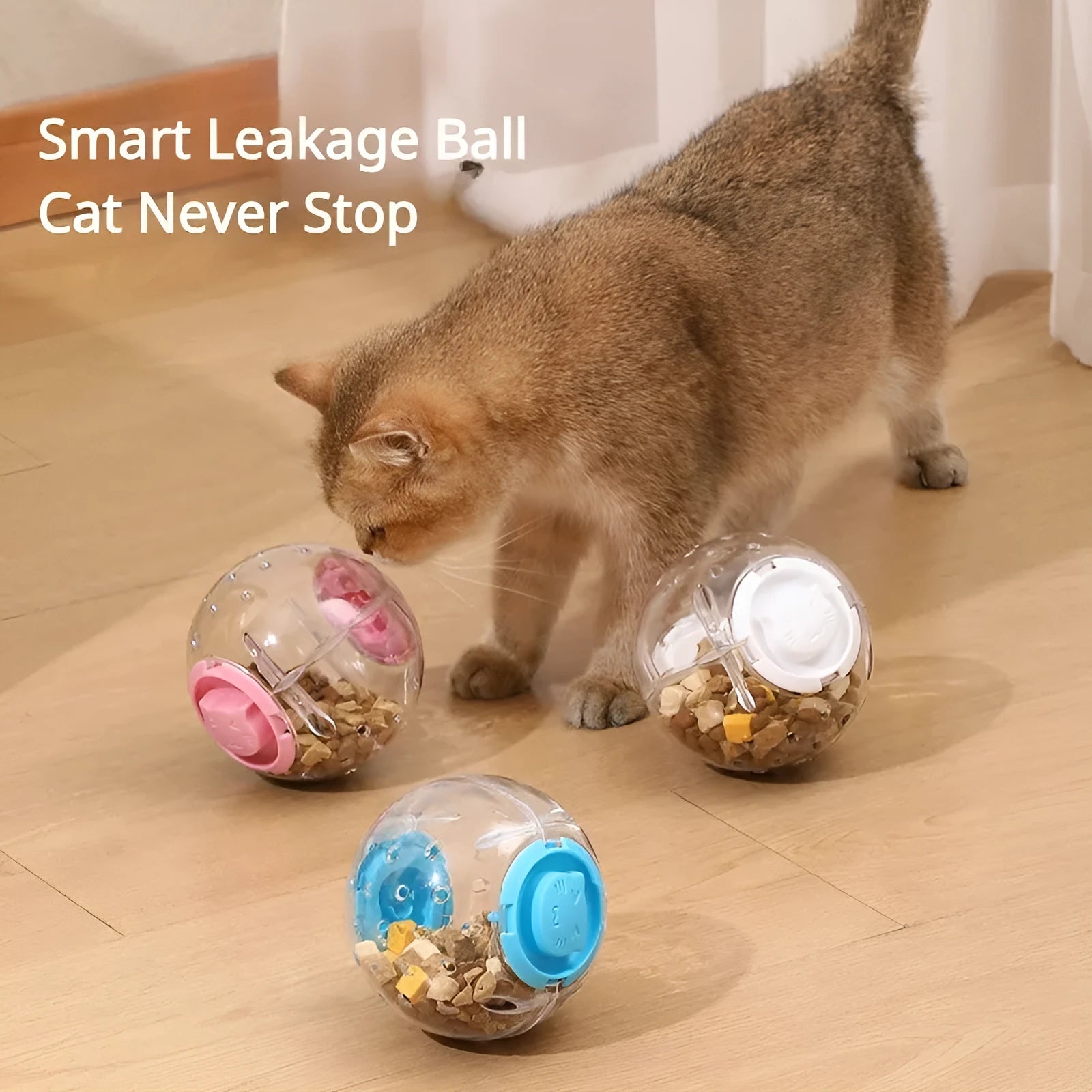 Blue slow feeding ball for cats and small dogs, 11.5cm ABS treat dispenser on floor