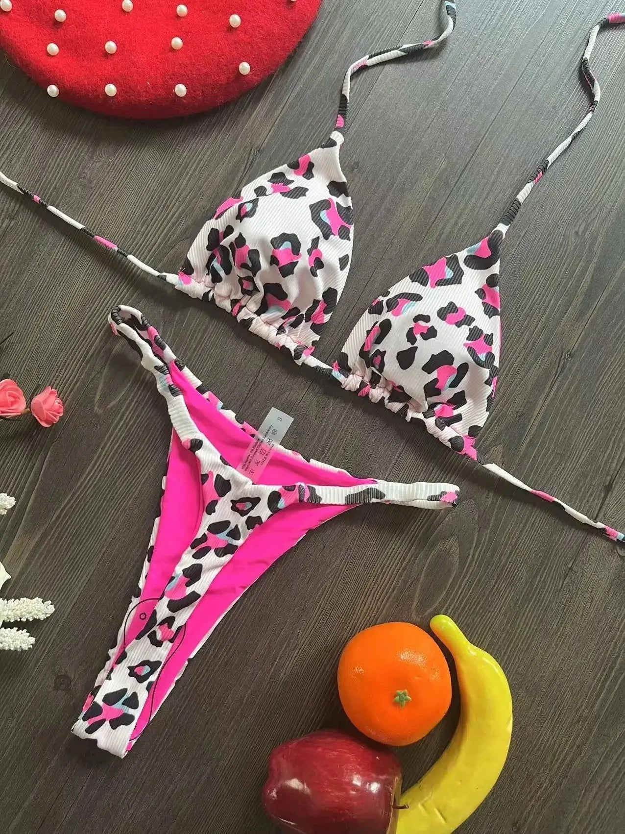 Women's printed bikini swimsuit set with quick-dry fabric on a mannequin, showing briefs style.