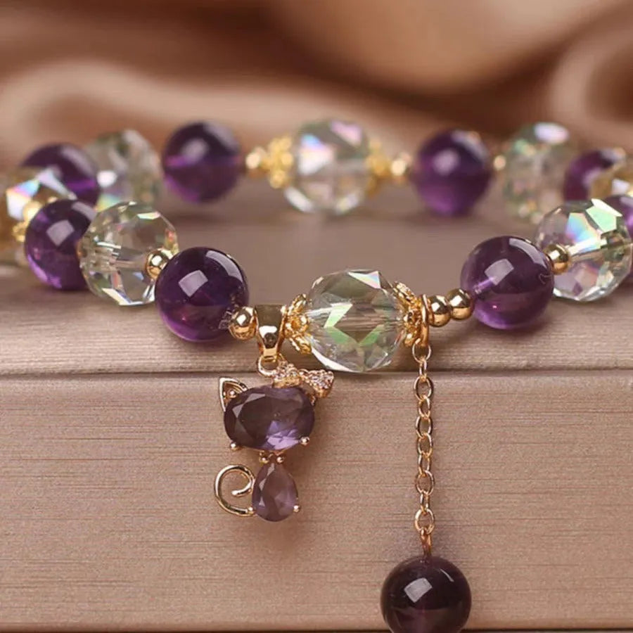 Natural amethyst fox pendant bracelet with five-leaf flower and nine-tailed fox charm, antique style, on a neutral background