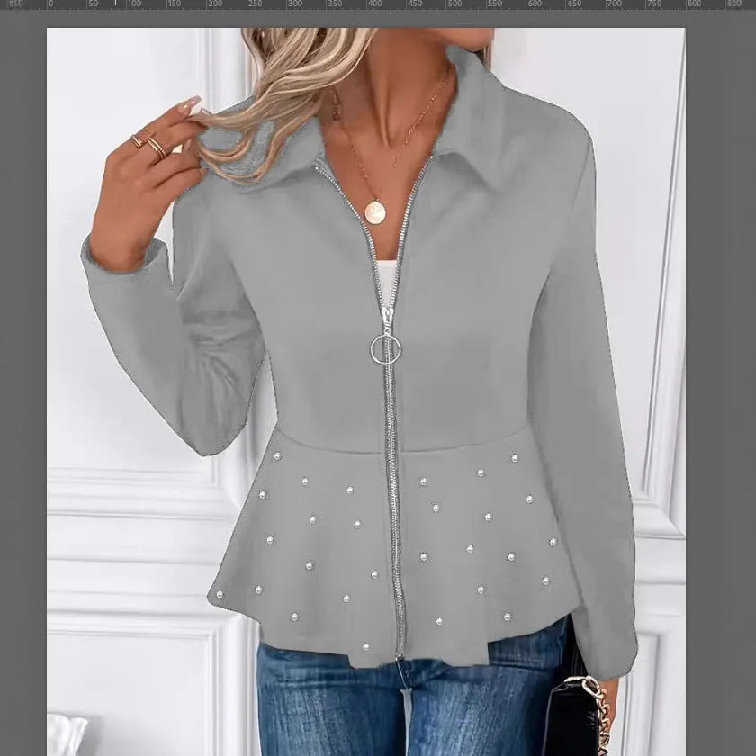 Women's loose black coat with beaded heavy-duty zipper and ruffled hem, shown on a hanger.