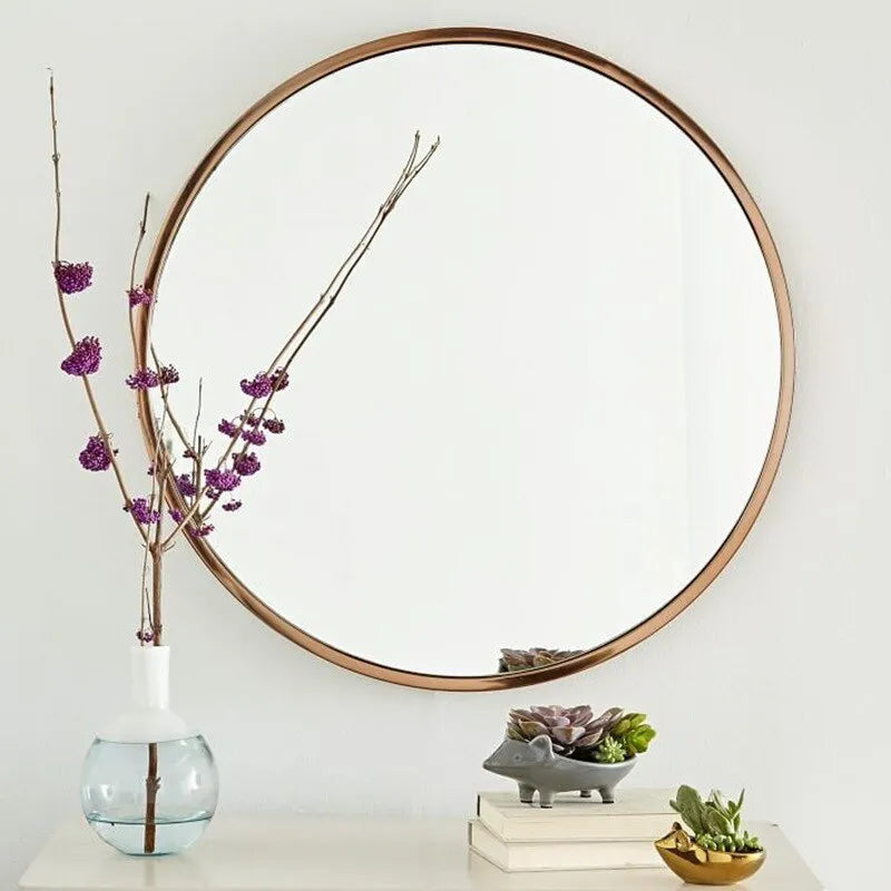 Round iron bathroom wall mirror in black finish, 30cm or 60cm diameter, hanging on a tiled wall for dressing and makeup use