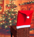 Set of Christmas chair covers with Santa Claus and snowman designs on standard dining chairs