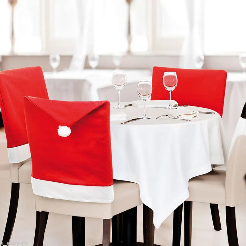 Set of Christmas chair covers with Santa Claus and snowman designs on standard dining chairs