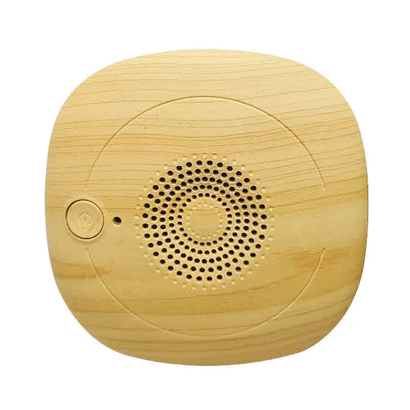 Bed vacuum cleaner with ultrasonic mite repellent, compact 120x120x45mm, on a bed surface