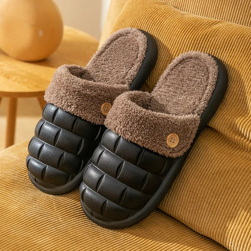 Women's pink and grey plaid EVA slippers with a detachable upper and plush lining on a wooden floor.