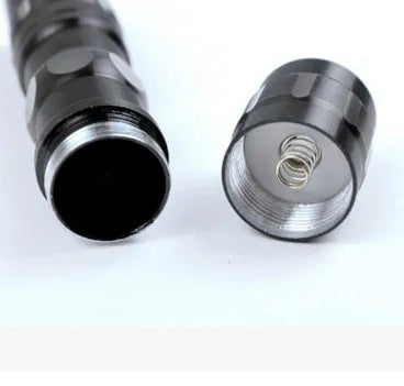 Black aluminium mini LED flashlight measuring 9.5cm long