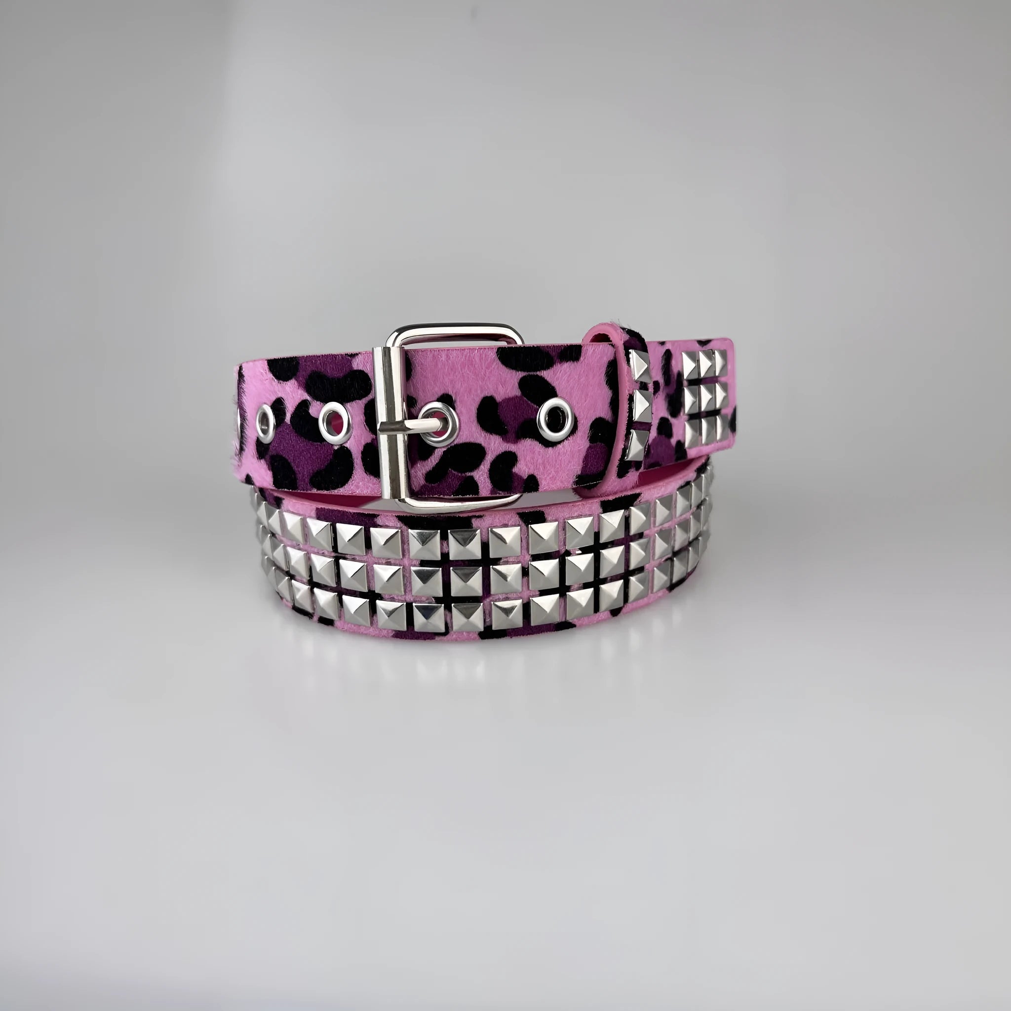 Women's punk fashion belt with metal rivets and pyramid studs in leopard print pattern