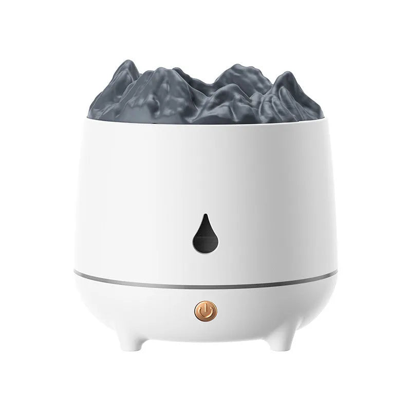 White volcano-shaped ultrasonic humidifier with USB cable on desk in a room