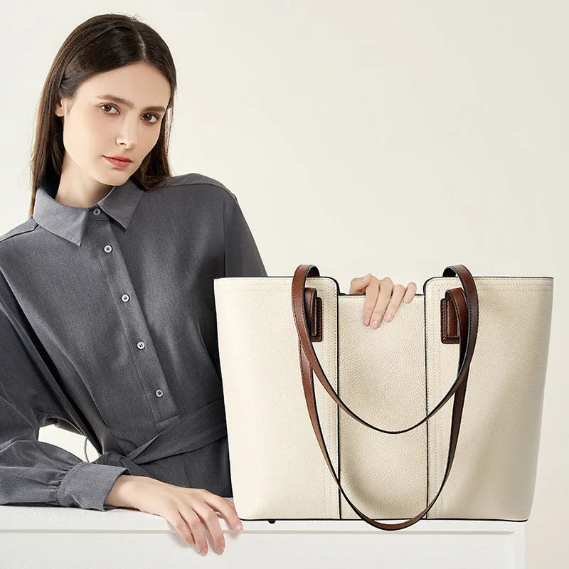 Women's black genuine leather crossbody commuter bag with horizontal square design showing internal organisation compartments