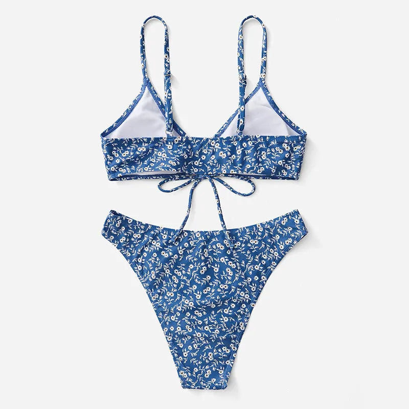 Blue three-piece women's swimsuit set with separate top and shorts on a mannequin.