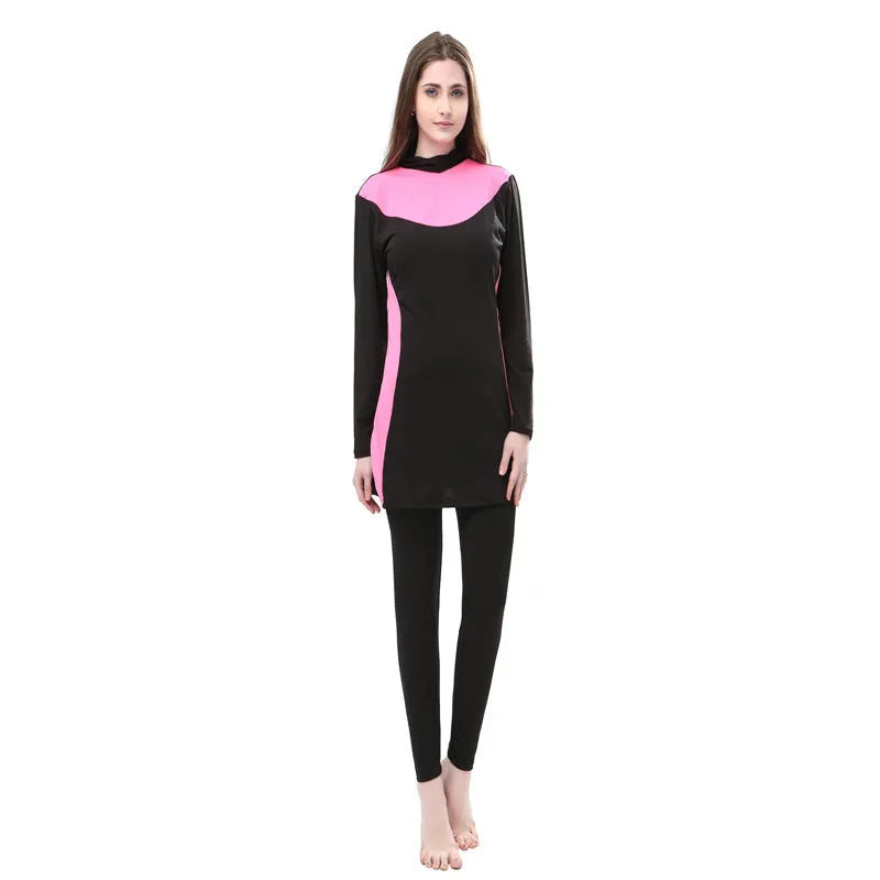 Black women's hooded long sleeve swimsuit with matching pants, shown in conservative one-piece style.