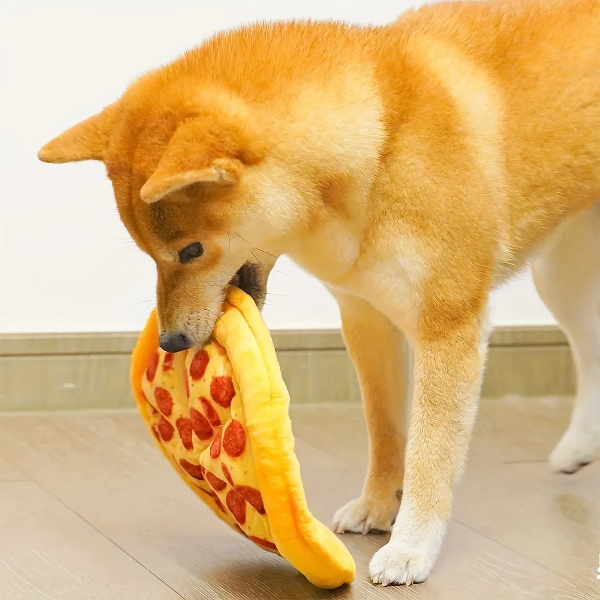 Yellow pizza slice dog chewing toy with squeaker for small to medium dogs