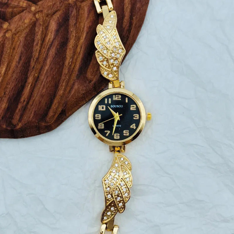 Women's stainless steel watch with round dial on wrist, showing gold surface colour option.