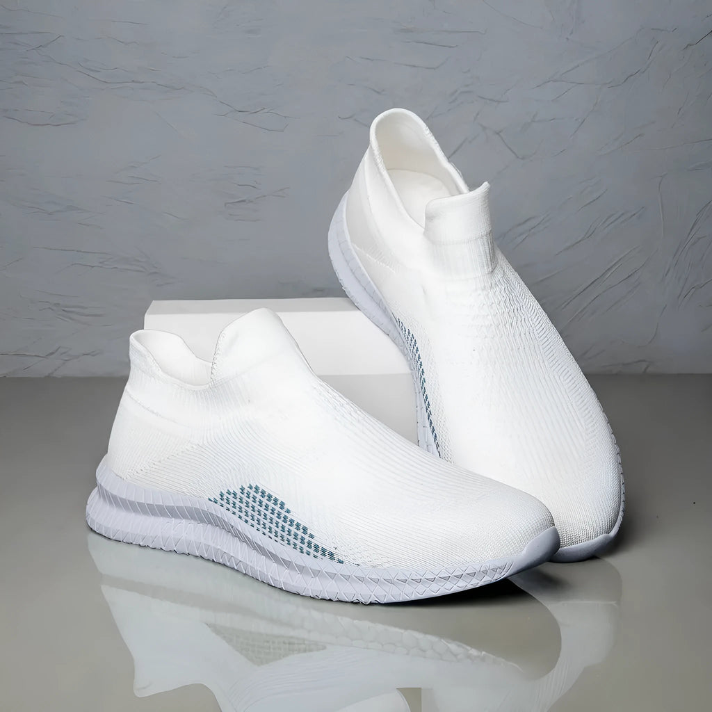 Popcorn Flyknit low-top fabric casual sneakers in black, shown from the side on a white background.