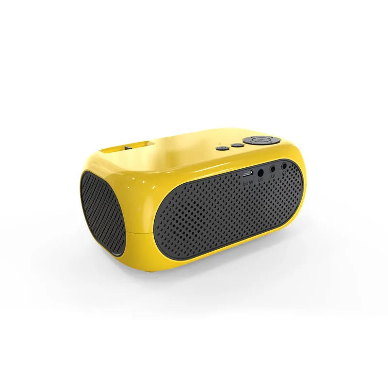 Compact gold and white M24 micro mini LED projector on a table with power adapter and AV cable.