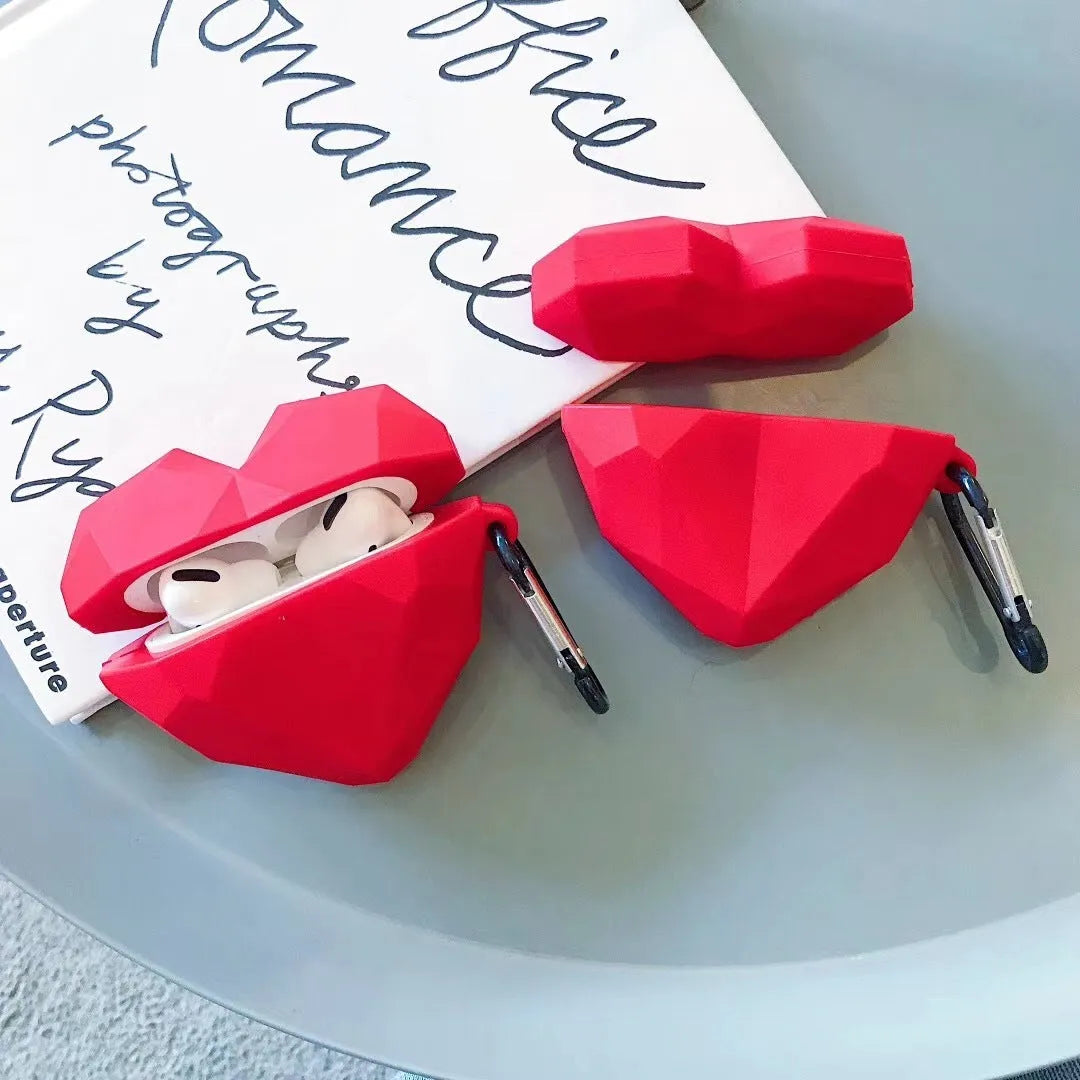 Red diamond love silicone case on Apple AirPods charging case with carabiner clip attached