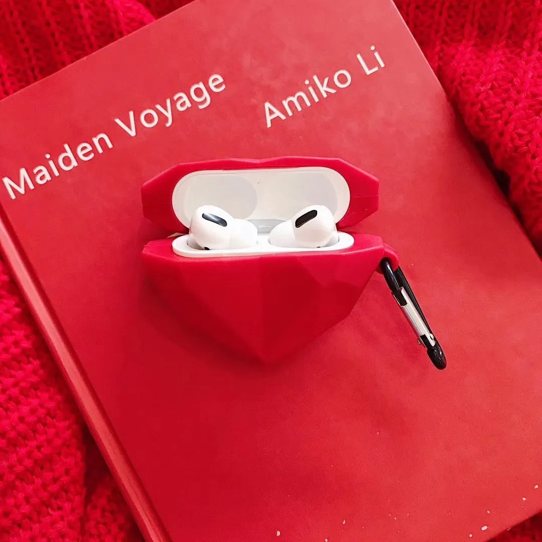 Red diamond love silicone case on Apple AirPods charging case with carabiner clip attached