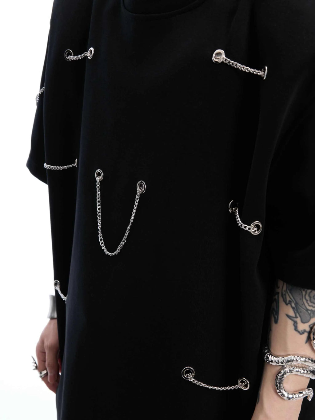 Black short sleeve T-shirt with metal chain detail on padded shoulders, round neck, heavy cotton fabric