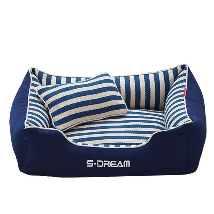 Navy stripe washable dog kennel mat with removable cover and matching mini pillow on a light background