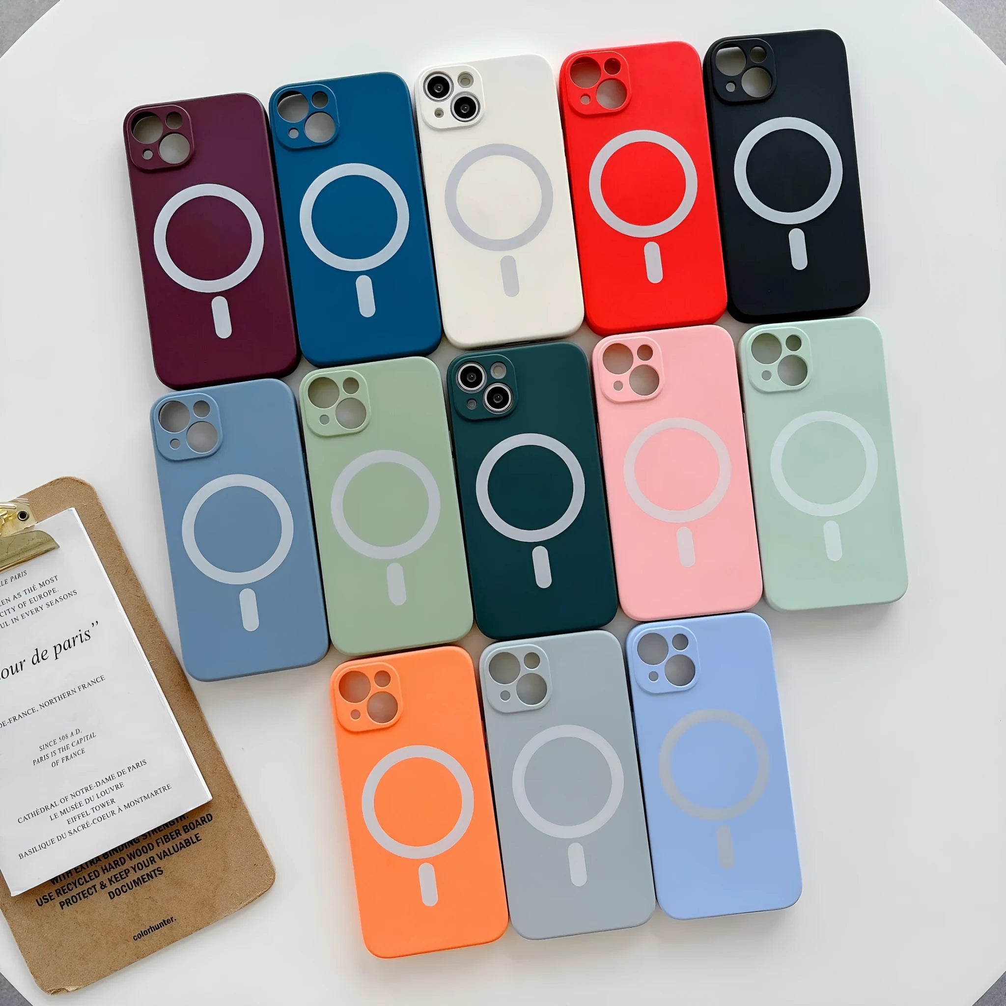 Magnetic TPU phone case for iPhone showing back cover with wireless charging ring in multiple colours
