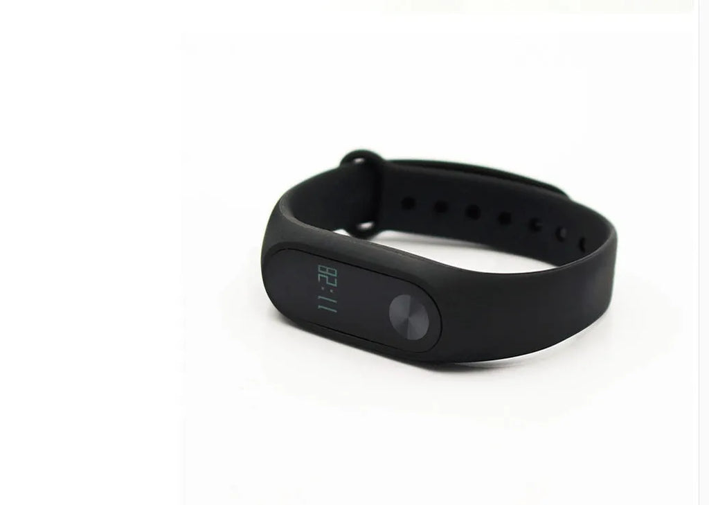 Xiaomi Mi Band 2 black smart fitness tracker with OLED touchscreen display on a wrist.